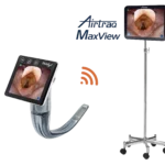 Airtraq Max View video laryngoscope connected wirelessly to medical monitor on mobile stand.